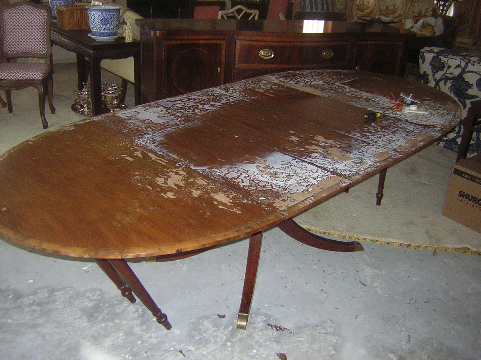 Before photo of water damaged table.